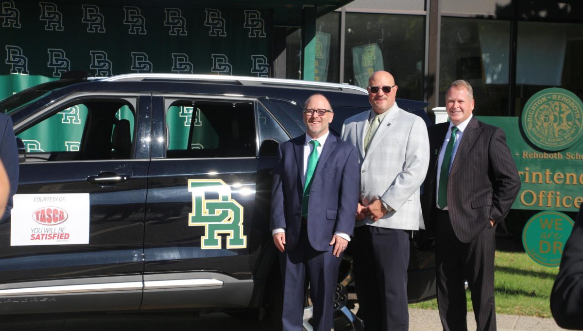 Mr. Demers, Michael Strojny, and Bill Runey confidently showing the new vehicle.
