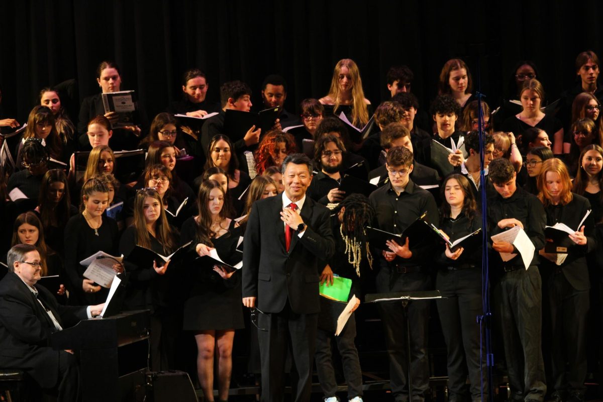 Tri-County Music Festival chorus performs in a combined chorus led by guest conductor, Dr. Zhou